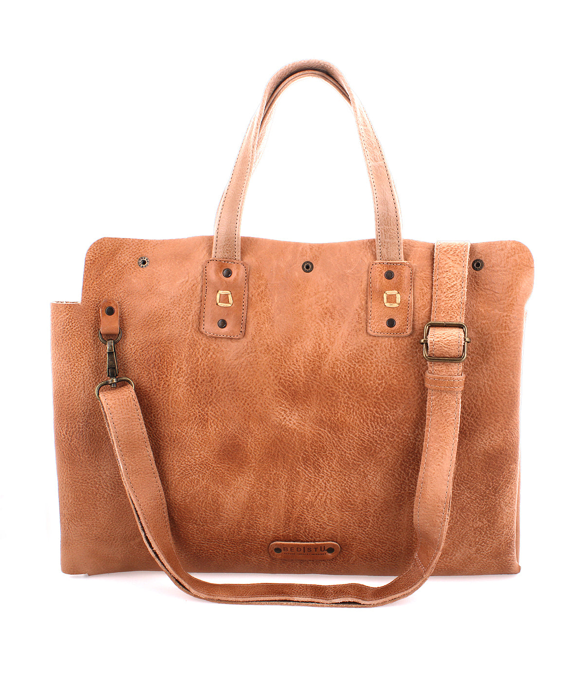 A tan leather tote bag with a shoulder strap, perfect for commuters, named the "Commuter" by Bed Stu.