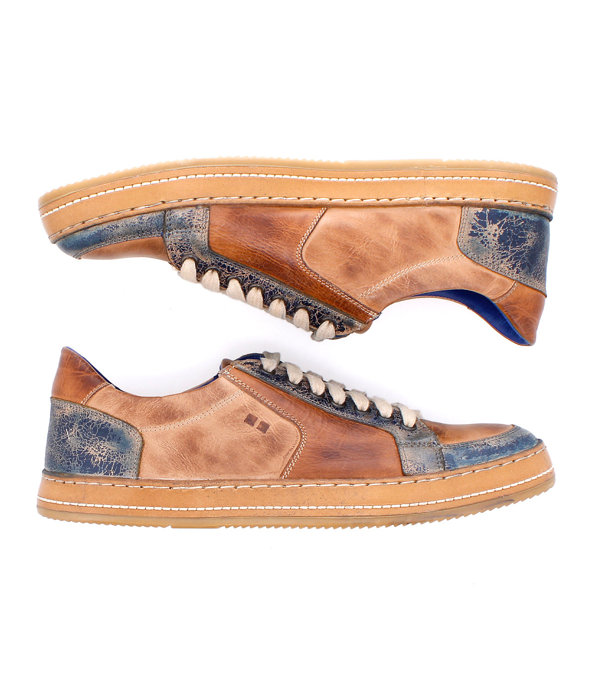 The Bed Stu Condor is a pair of brown and blue leather sneakers with beige soles and white laces, offering comfort and durability, shown side by side on a white background.