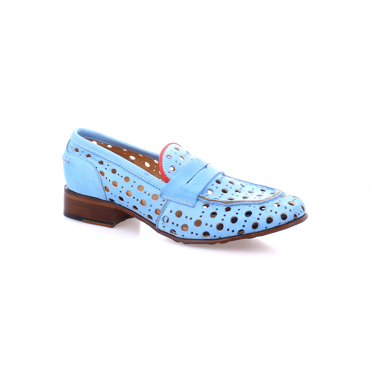 Cornflower by Bed Stu is a light blue perforated leather shoe with a wooden heel, featuring a playful circular cutout pattern and pink accents around the edges. This handcrafted beauty combines elegance with a unique design.