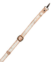 The Bed Stu Crossbody Strap features metallic gold adjustable leather with metal hardware and buckle, ideal for Bed Stu bags or as a chic crossbody accessory, displayed on a white background.