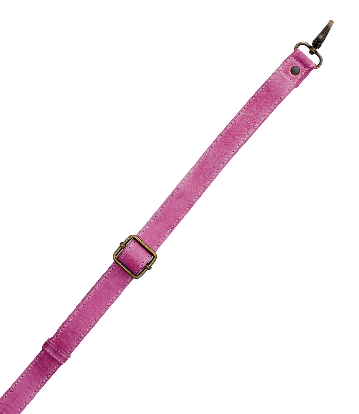 A pink leather Crossbody Strap by Bed Stu, featuring an adjustable design with a brass buckle and metal clasp on one end, is displayed diagonally on a white background.