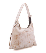 Off-white, organized full-grain leather Bed|Stü Decatur LTC hobo bag with a mottled pattern, a single shoulder strap, and an exposed top zipper.