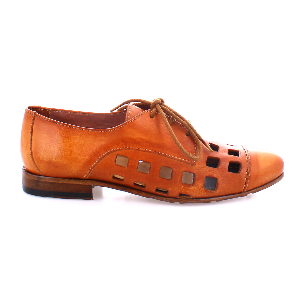 A brown leather dress shoe with bold square cutout patterns and a playful lace-up derby, featuring a low wooden heel, handcrafted in Italy - the Decoy by Bed Stu.