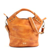 Bed Stu Delilah, a tan leather handbag with studs and handles, exudes carefree versatility and compact cuteness.