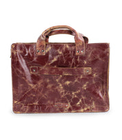 The Depp by Bed Stu is a minimalist brown leather briefcase with two handles, visible wear and creasing, plus a front slip pocket—perfect for timeless work style.