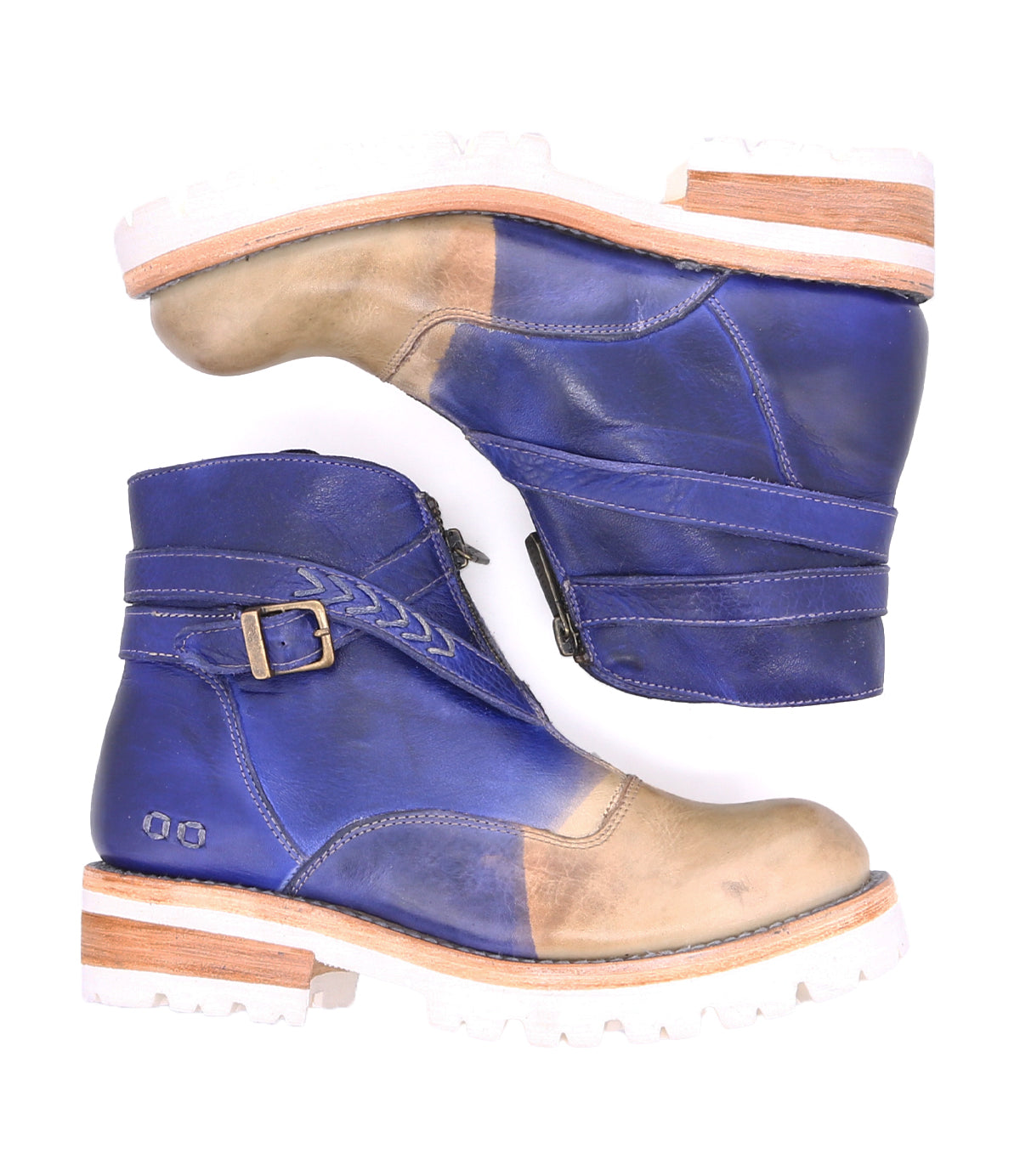 A lightweight pair of Dessa boots by Bed Stu with crisscross straps on a white background.