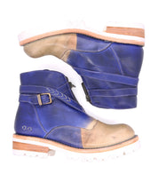 A lightweight pair of Dessa boots by Bed Stu with crisscross straps on a white background.