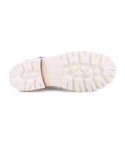 A lightweight pair of Dessa shoes with white soles and crisscross straps on a white background for ultimate comfort from the brand Bed Stu.