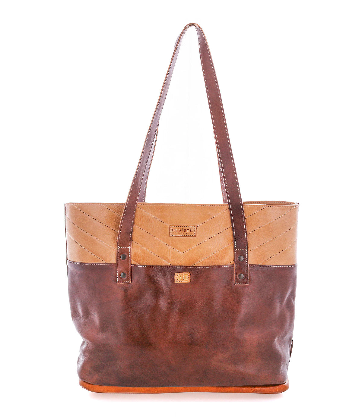 The Bed Stu Dome is a two-tone leather tote with a tan top and dark brown bottom, double shoulder straps, and stitched upper detail—ideal for carrying work essentials in its spacious interior.