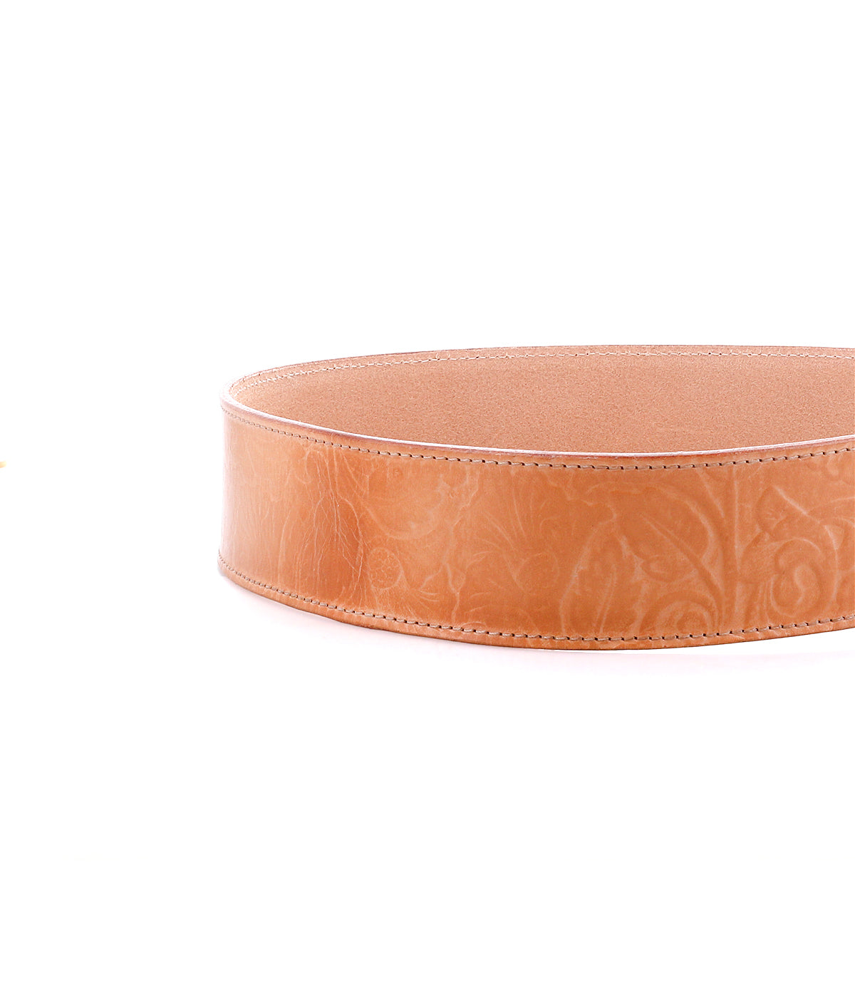 A tan Bed Stu Dreampath EM leather circular tray with embossed floral patterns, inspired by a genuine leather belt, shown against a white background.