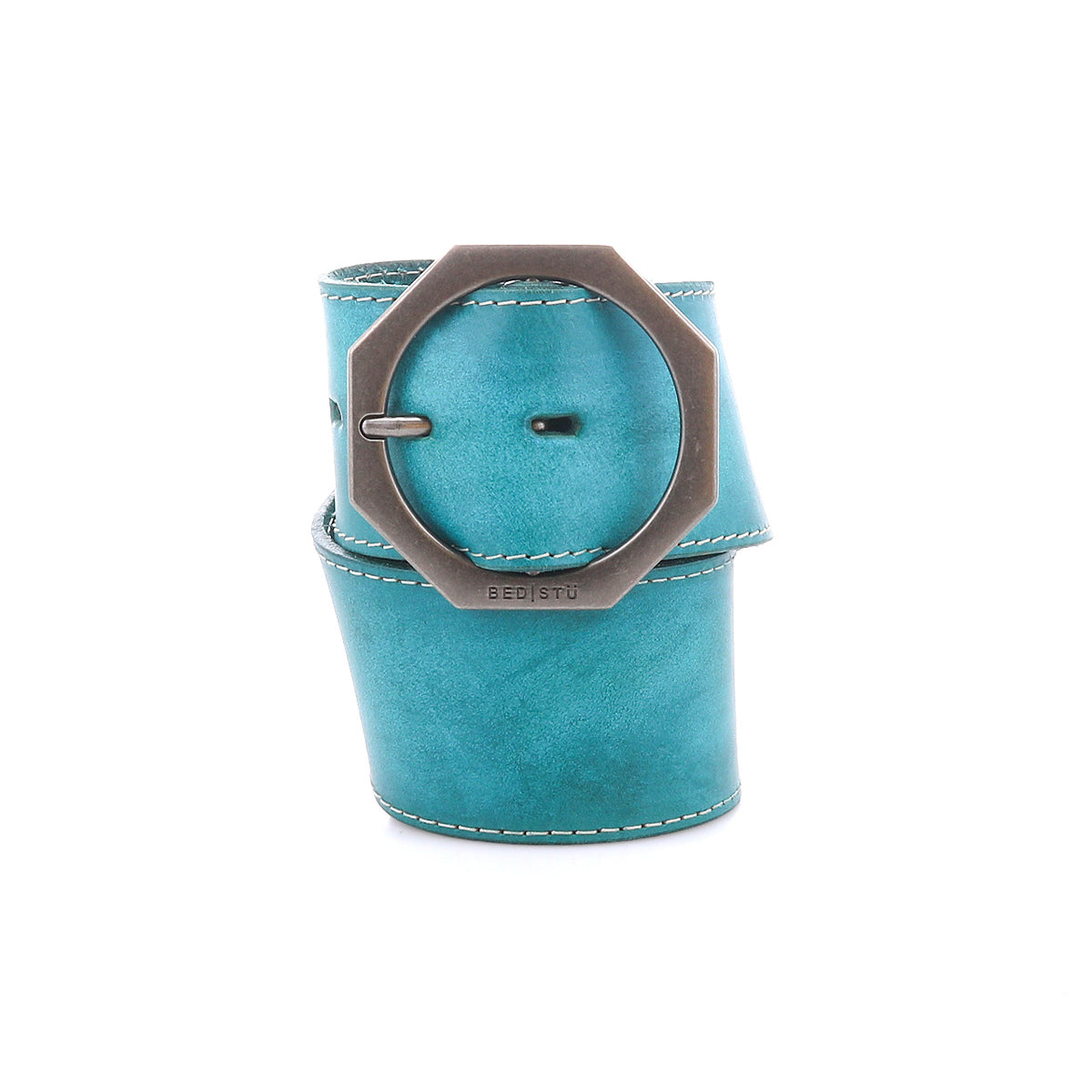 The Bed Stu Dreampath is a wide teal genuine leather belt with white stitching and a large octagon buckle, rolled up on a white background to highlight its rugged durability and bold design.