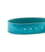 The Bed Stu Dreampath belt is a wide, teal genuine leather accessory with white stitching and four rectangular holes, designed for rugged durability against a white background.