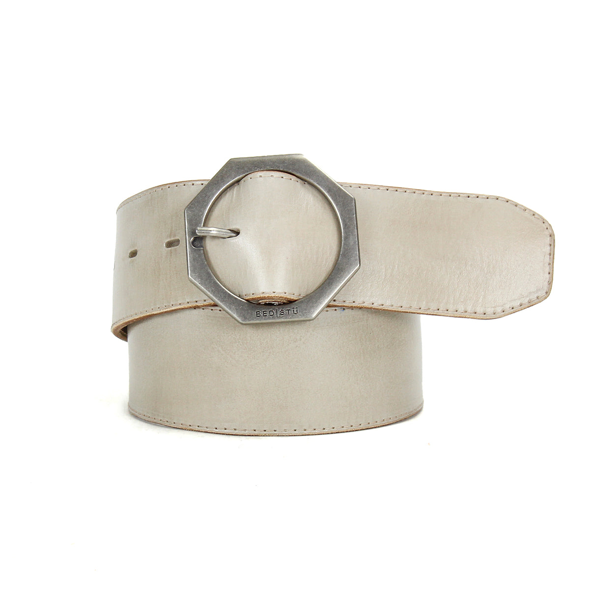 The Bed Stu Dreampath is a wide beige genuine leather belt with rugged durability, featuring an octagon metal buckle, shown coiled on a white background.