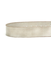 A close-up of the Bed Stu Dreampath genuine leather belt in metallic silver, showing detailed edge stitching, multiple adjustment holes, and an octagonal metal buckle.