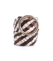 Introducing the Dreamweaver by Bed Stu—a woven belt rolled with a captivating black and white checkered design, adorned with a large brass-tone buckle that exudes a vintage allure.
