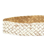 A white Dreamweaver belt from Bed Stu that exudes vintage allure on a white background.