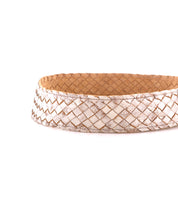 A close-up of the Bed Stu Dreamweaver belt, featuring a light brown and white boho design with a textured basket-weave pattern, displayed against a white background.