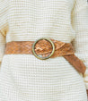 A woman wearing a white Dreamweaver sweater by Bed Stu with a vintage allure.