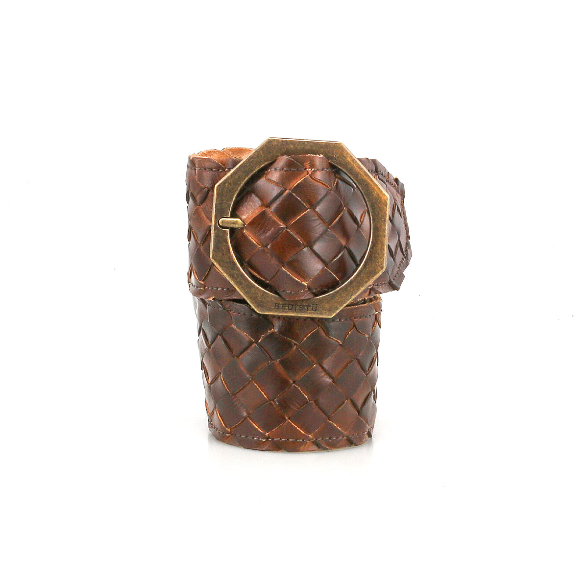 The Dreamweaver by Bed Stu is a wide brown woven leather cuff bracelet, featuring a statement metal buckle and a bold octagonal brass accent inspired by vintage boho belt designs.