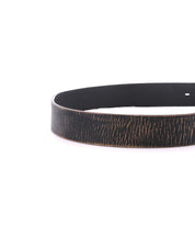 A close-up of the Drifter belt by Bed Stu, featuring a textured black woodgrain pattern against a white background, is the perfect dapper accessory for your weekend ensemble.