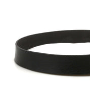 A close-up of the Drifter belt by Bed Stu, its black leather looped into a circle on a white background—a perfect weekend accessory.