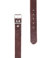 Close-up of the Drifter by Bed Stu—a brown leather belt with a silver buckle and multiple holes, delivering dapper appeal to any outfit. Ideal as a stylish weekend accessory.