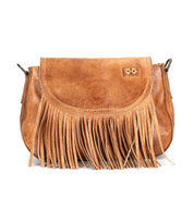 The Bed Stu Eastend is a brown leather crossbody bag with a flap closure and long front fringe—a handmade, boho-chic accessory.