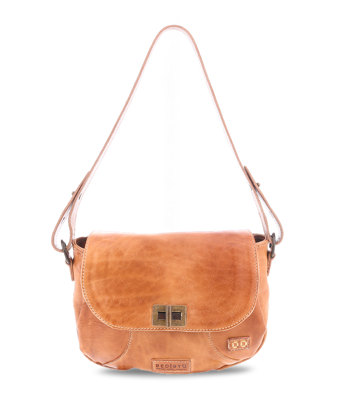 The Elect by Bed Stu is a chic tan leather shoulder bag with vintage charm, featuring a flap closure and adjustable shoulder strap. The front showcases a decorative buckle and subtle logo tag.