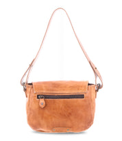 The Bed Stu Elect is a vintage-style brown leather handbag featuring a top flap, front zip pocket, an adjustable strap for ultimate comfort, and a distinctive embossed logo at the bottom.