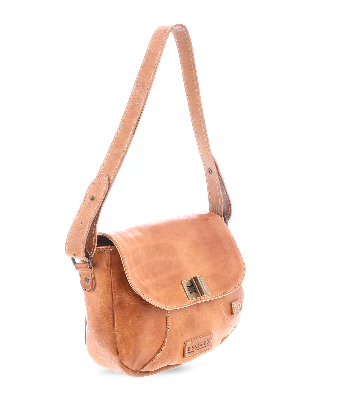 The vintage charm of the Bed Stu Elect tan leather shoulder bag is highlighted by its flap cover with a metal clasp and long adjustable shoulder strap.