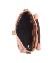 Top view of the Bed Stu Elect bag, a brown leather handbag showcasing a dark interior with a brass clasp and side handle. Its adjustable shoulder strap enhances functionality, while its vintage charm shines through.