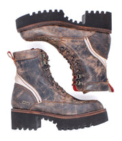 Two Elisha Hi boots by Bed|Stü are shown side by side against a white background, featuring rugged brown leather, a classic lace-up profile, and thick textured rubber soles.
