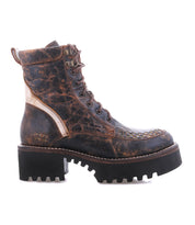 The Bed|Stü Elisha Hi, a brown distressed leather combat boot with visible stitching and a chunky lug sole, is shown in a lace-up profile against a white background.