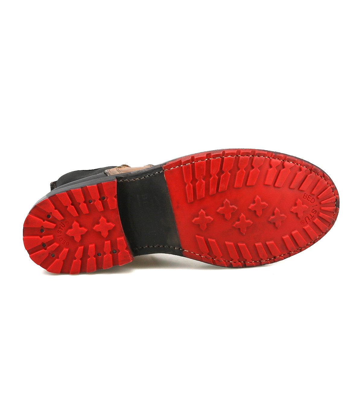 The image displays the bottom view of the Ethic Chelsea boot by Bed Stu, highlighting its red Vibram sole with deep tread patterns for enhanced traction.