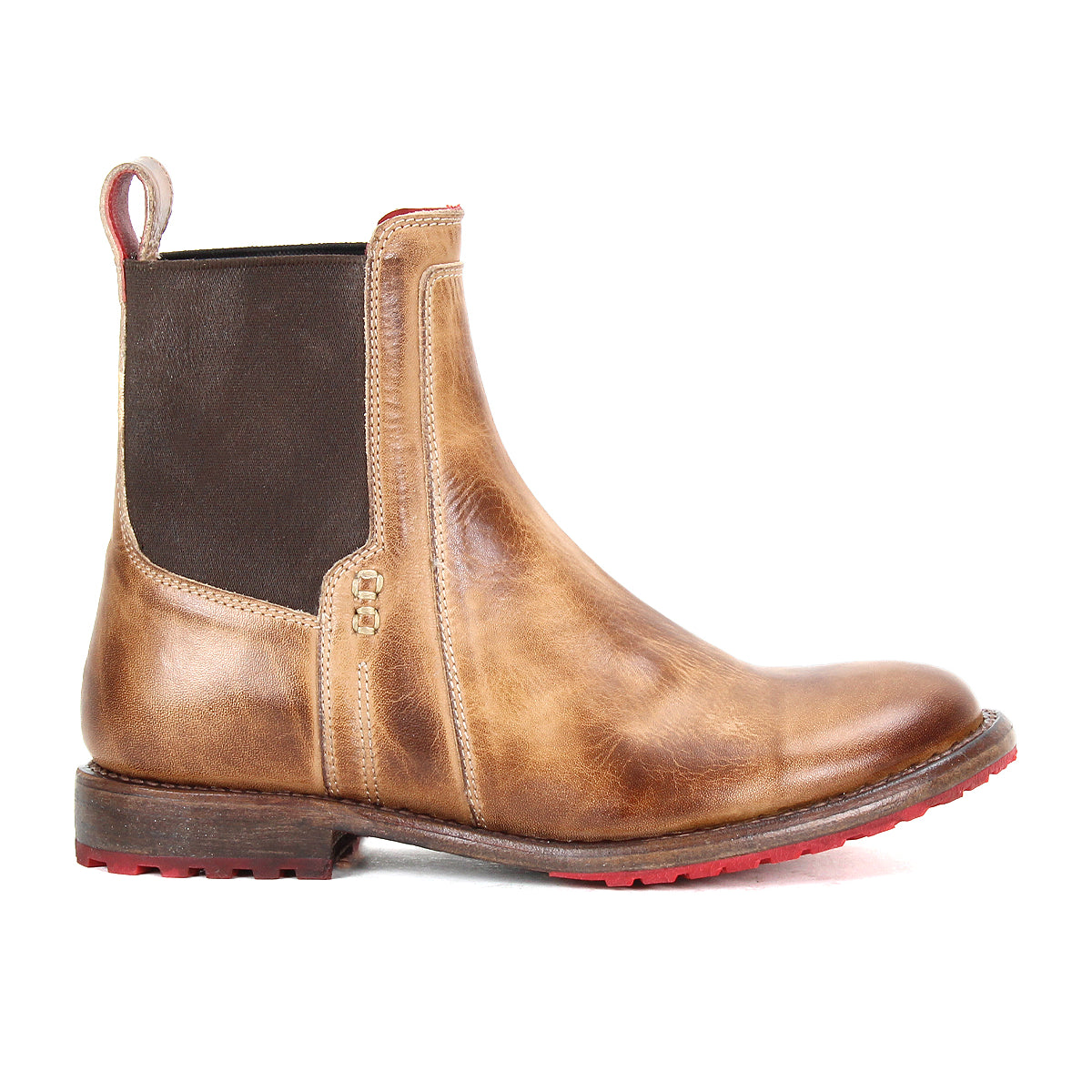 The Bed Stu Ethic is a brown Chelsea boot made from vegetable-tanned leather, with an elastic side panel, back pull tab, and bold red Vibram sole—shown in a side view.