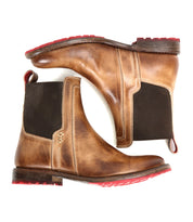 A pair of Ethic Chelsea boots by Bed Stu, crafted from brown vegetable-tanned leather with black elastic side panels and red Vibram soles, displayed side by side on a white background.