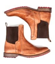 The Bed Stu Ethic boots are a pair of tan vegetable-tanned leather Chelsea boots with dark brown elastic side panels and red Vibram soles, displayed side by side on a white background.