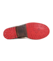 The Ethic by Bed Stu features a Chelsea boot design with a red Vibram sole, brown vegetable-tanned leather heel, metal nails, and visible stitching on the bottom.