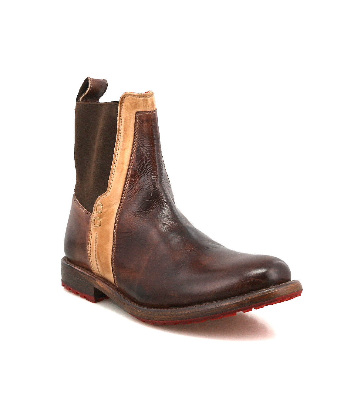 The Bed Stu Ethic is a brown vegetable-tanned leather Chelsea boot featuring tan side panels, elastic accents, a pull tab, and a red Vibram sole, shown on a plain white background.