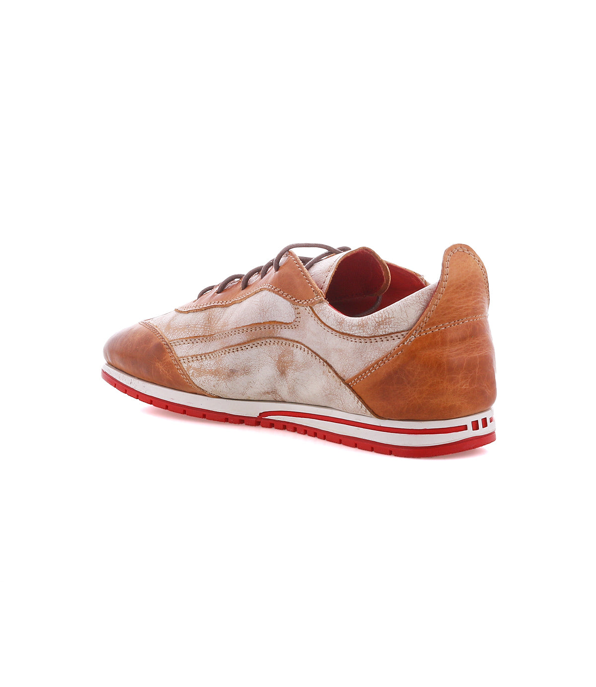The Bed|Stü Extravagant is a brown and white low-top sneaker with a lace-up silhouette and distinctive red outsole, showcasing worn-in leather details. Shown from the back left side on a white background, it’s perfect for everyday wear.