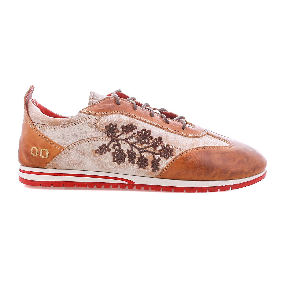 Here’s a rewritten version using your product data: The Bed|Stü Extravagant is a brown and beige sneaker featuring a lace-up silhouette, red sole, floral embroidery on the side, and gold accents near the heel—crafted for effortless everyday wear.