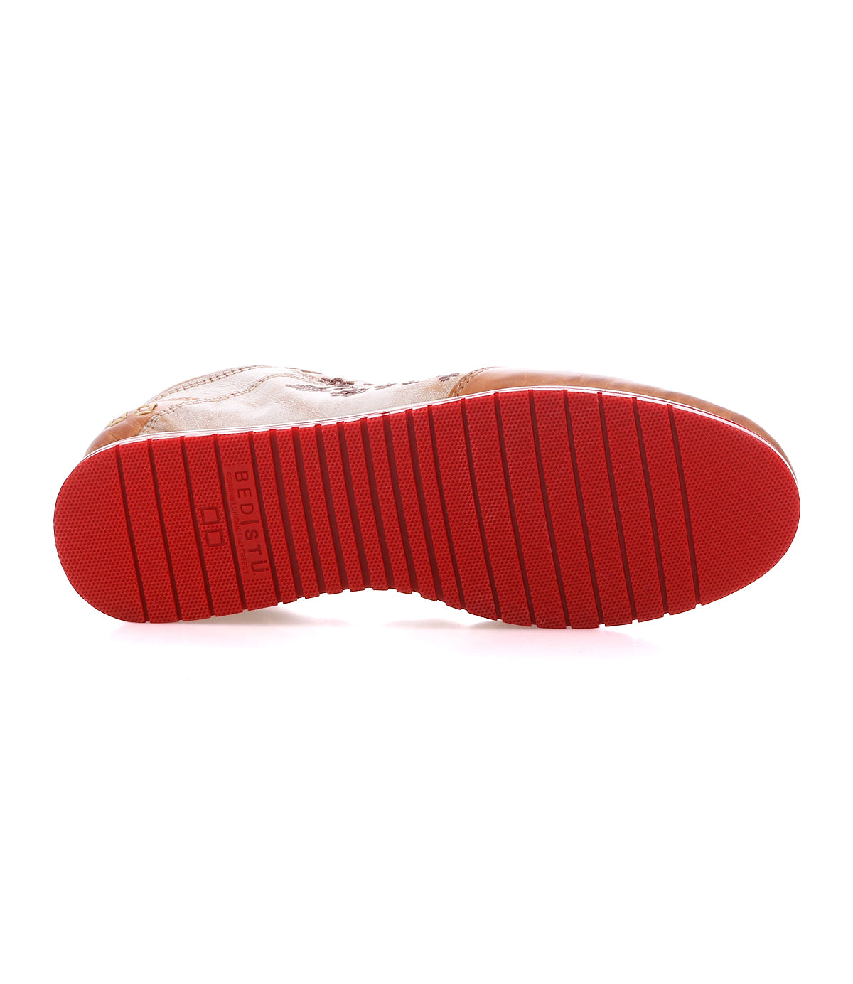 A shoe with a bright red ridged sole is shown from the bottom, displaying the tread pattern and the word “Bed|Stü” embossed near the heel—a perfect choice for classic everyday wear, featuring the Extravagant style.