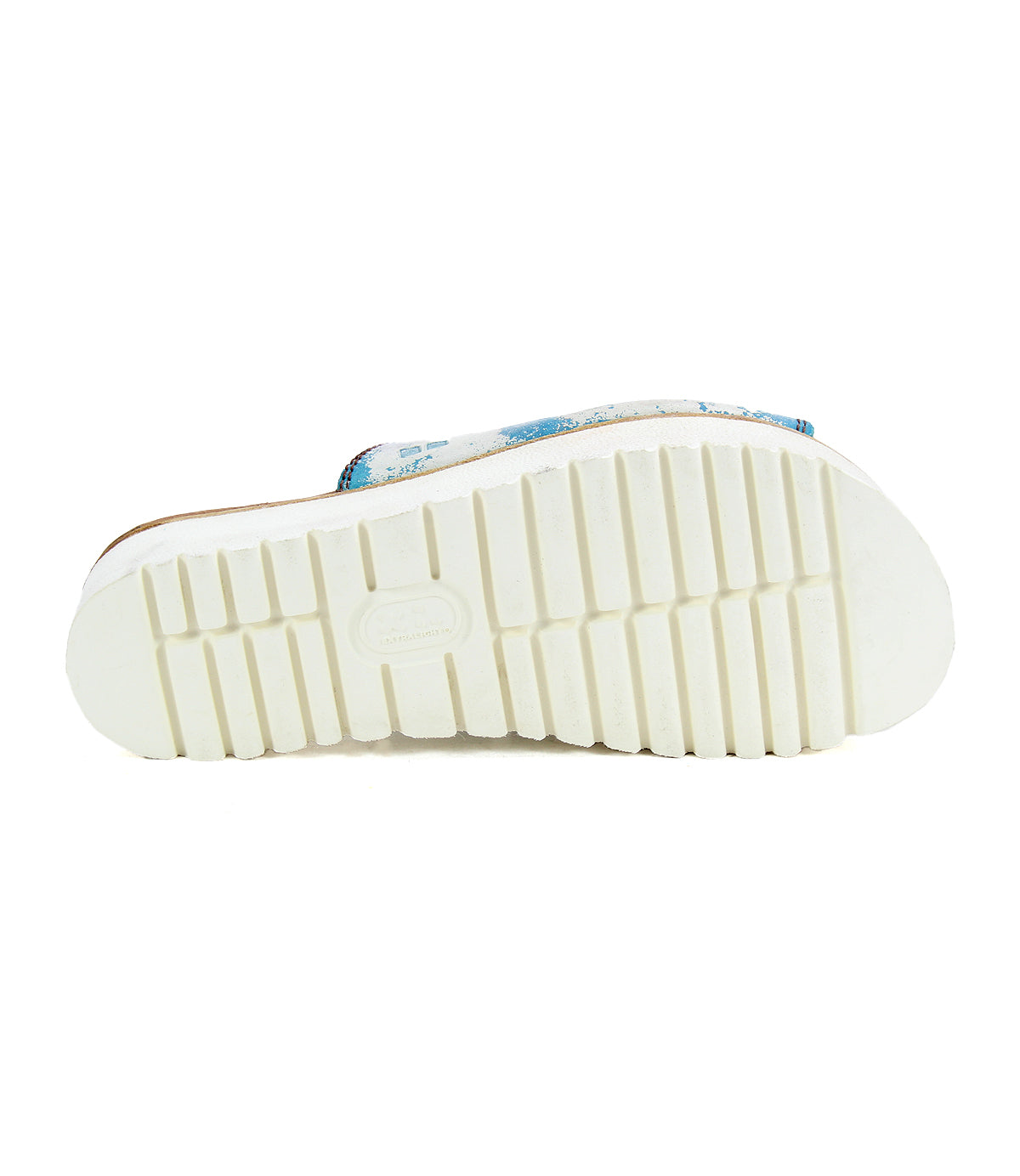 The Bed Stu Fairlee II features a flatform leather slide sandal with a grooved white rubber outsole and blue patterned detail on the upper side.