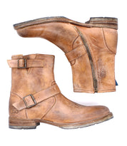 The Bed Stu Fellow is a rugged brown leather moto-inspired ankle boot featuring buckles and side zippers, shown from the side and bottom views on a white background.