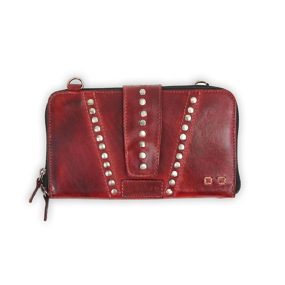 A Bed Stu Flee, a leather clutch in red, features metal stud embellishments, a central strap, and a secure zip closure.
