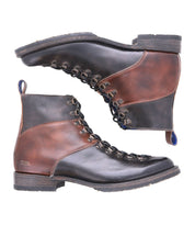 A pair of Bed Stu Frenzy brown and black leather lace-up boots is displayed in a side view, placed horizontally with soles facing outward. Crafted with Goodyear welt construction, these men's hiking boots offer durability and style, making them perfect for outdoor adventures.