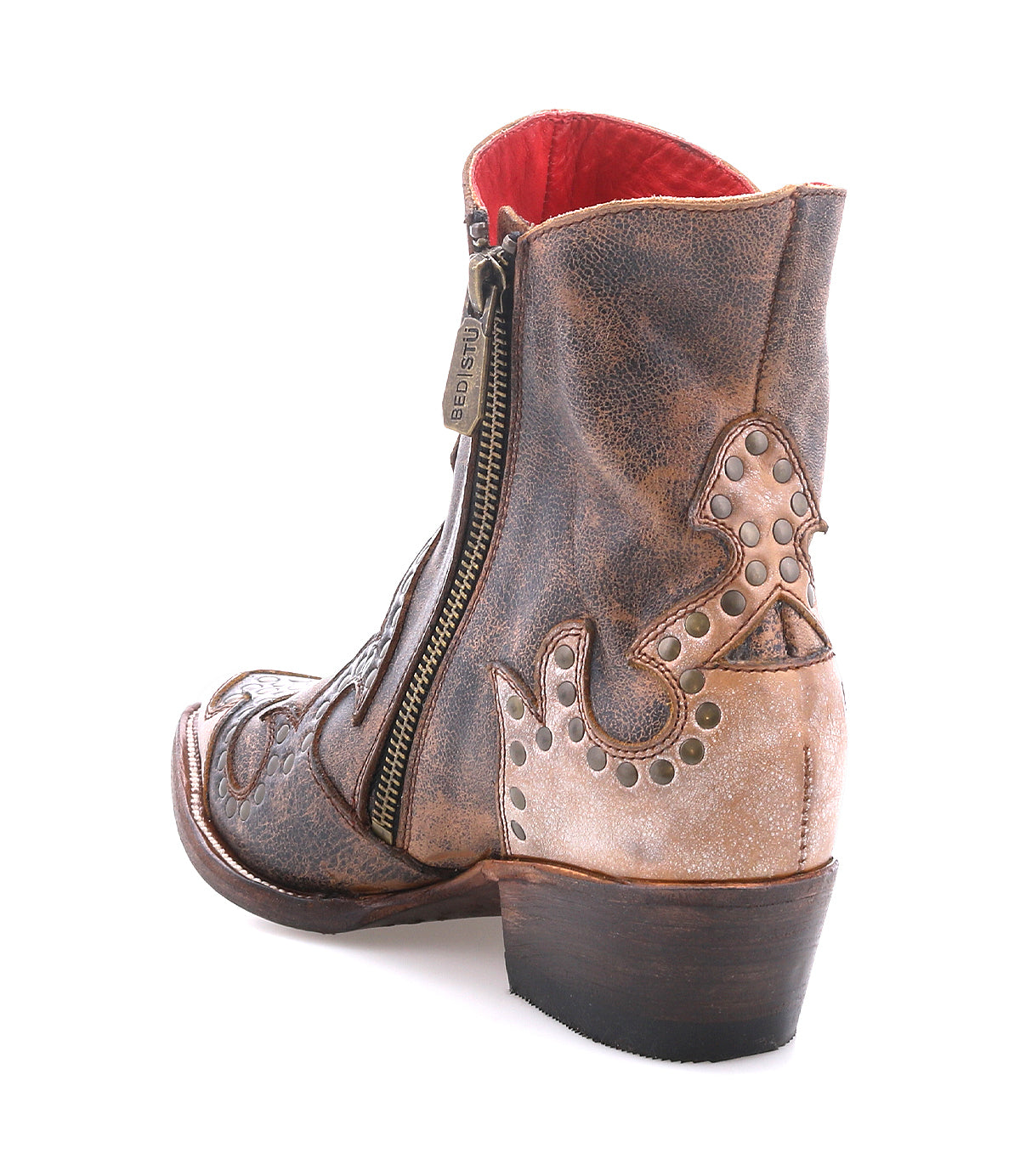 The Bed Stu Frio is a brown and tan leather Western bootie with floral cutouts, decorative stitching, brass studs, a side zipper, and a low heel, shown on a white background.