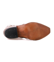 The image shows the bottom view of the Bed Stu Frio, a brown leather dress shoe featuring a pointed toe, black rubber heel, and subtle floral cutout detailing.