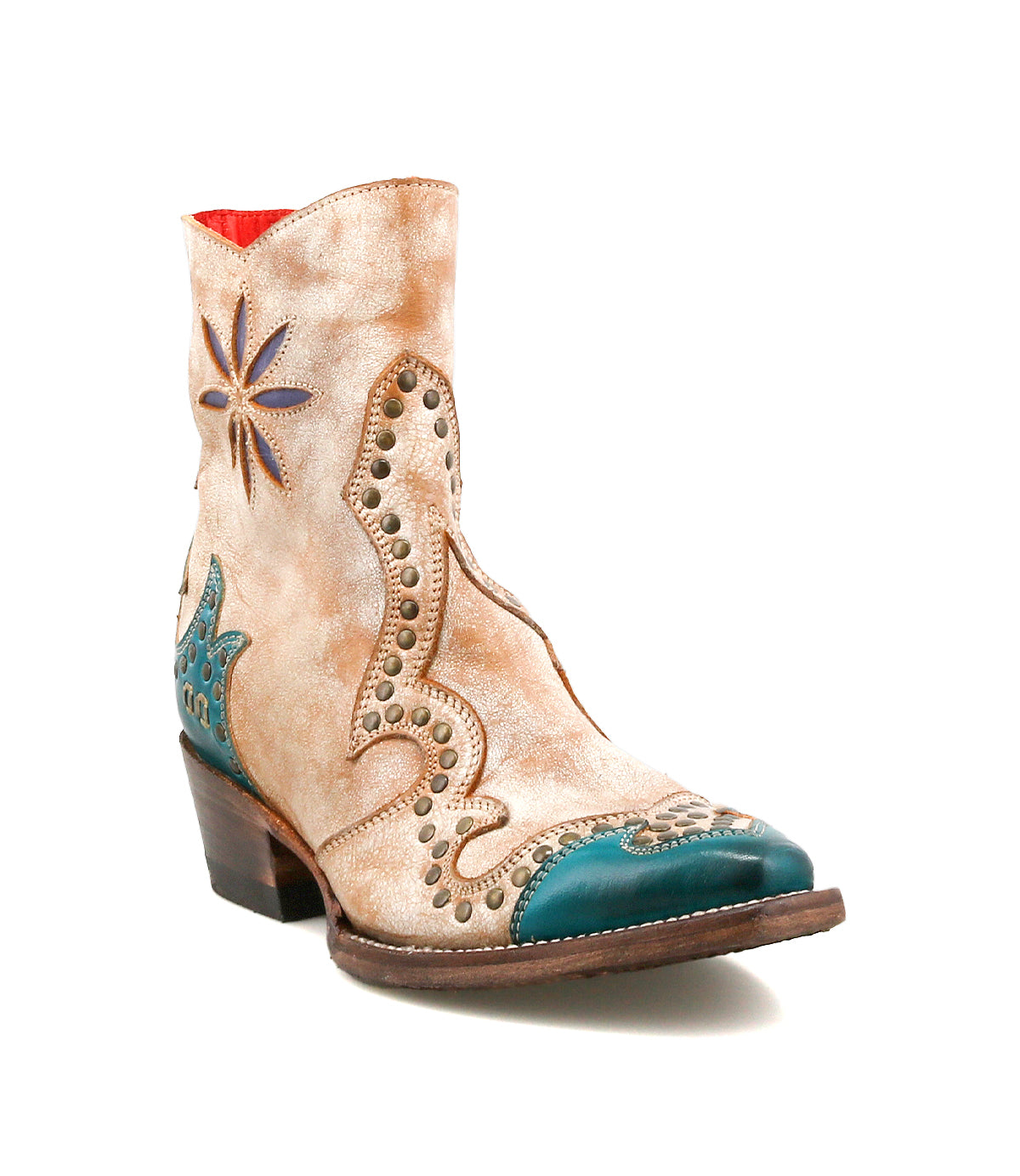 The Bed Stu Frio is a tan and turquoise leather Western bootie featuring decorative stitching, brass studs, a side star detail, floral cutouts, and a low stacked heel.