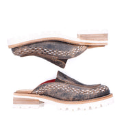 Two Bed Stu Fuel brown leather slip-on shoes with white lightweight outsoles, visible stitching, and a flexible fit; displayed horizontally, one facing up and the other facing down.